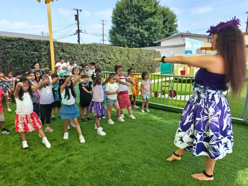 Children dancing outdoors summer activity
